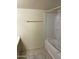 A full bathroom shows a tub with shower and tile flooring at 18239 N 40Th St # 115, Phoenix, AZ 85032