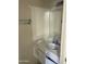 Bathroom with a mirror, vanity, sink, and an enclosed shower/tub at 18239 N 40Th St # 115, Phoenix, AZ 85032