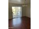 Dining room features wood-look floors and sliding glass doors to an outdoor balcony at 18239 N 40Th St # 115, Phoenix, AZ 85032