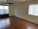 Living room featuring wood-look flooring and natural light with ceiling fan at 18239 N 40Th St # 115, Phoenix, AZ 85032