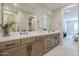 Modern bathroom features double sinks, quartz countertops, and updated fixtures at 2121 W Sonoran Desert Dr # 95, Phoenix, AZ 85085