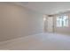 This empty bedroom with carpet floors, neutral paint and natural light from the window at 2121 W Sonoran Desert Dr # 95, Phoenix, AZ 85085