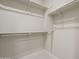 Spacious walk-in closet offers ample storage with shelving and rods for organization at 2121 W Sonoran Desert Dr # 95, Phoenix, AZ 85085