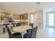 Open-concept kitchen and dining area are perfect for entertaining, complemented by neutral colors at 2121 W Sonoran Desert Dr # 95, Phoenix, AZ 85085