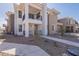 Attractive two-story home with stucco facade, a small balcony, and xeriscaped front yard at 2121 W Sonoran Desert Dr # 95, Phoenix, AZ 85085