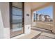 Modern front door featuring a glass pane, contemporary hardware, and a covered porch at 2121 W Sonoran Desert Dr # 95, Phoenix, AZ 85085