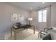 Well-lit home office with a modern desk setup, comfortable seating, and ample space for productivity at 2121 W Sonoran Desert Dr # 95, Phoenix, AZ 85085