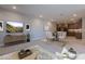 Open-concept living area with dining space, seamlessly connected to a modern kitchen featuring wood cabinetry at 2121 W Sonoran Desert Dr # 95, Phoenix, AZ 85085
