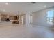 Bright and spacious living room with tile floors, neutral walls, and view into the kitchen at 2121 W Sonoran Desert Dr # 95, Phoenix, AZ 85085