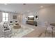 Bright living room features modern furnishings, neutral tones, and a large television for entertainment at 2121 W Sonoran Desert Dr # 95, Phoenix, AZ 85085