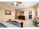 Primary bedroom with cozy decor, a ceiling fan, and carpet flooring at 23024 N De La Guerra Ct, Sun City West, AZ 85375