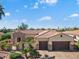 Beautiful exterior view of a well-maintained home with a red tile roof and manicured landscaping at 23024 N De La Guerra Ct, Sun City West, AZ 85375