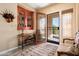 Inviting foyer featuring stylish decor, natural light, and a decorative rug that welcomes you inside at 23024 N De La Guerra Ct, Sun City West, AZ 85375