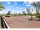 Scenic view of a lush golf course and neighboring homes under a clear blue sky, perfect for golf enthusiasts at 23024 N De La Guerra Ct, Sun City West, AZ 85375