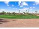 Manicured golf course with surrounding houses and desert landscaping at 23024 N De La Guerra Ct, Sun City West, AZ 85375