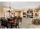 Open-concept space with a dining area that integrates the kitchen and living areas at 23024 N De La Guerra Ct, Sun City West, AZ 85375