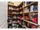 Walk in pantry with wood shelving and ample space at 23024 N De La Guerra Ct, Sun City West, AZ 85375