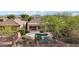 Aerial view of a backyard with a sparkling pool and desert landscaping at 2534 W Muirfield Dr, Anthem, AZ 85086