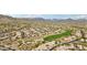 Aerial view showcases a community with golf course and desert mountain views at 2534 W Muirfield Dr, Anthem, AZ 85086