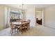 Cozy dining room featuring a chandelier and large window with natural light at 2534 W Muirfield Dr, Anthem, AZ 85086