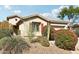 Charming single-story home featuring vibrant landscaping and a well-maintained desert-style yard at 2534 W Muirfield Dr, Anthem, AZ 85086