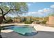 Backyard pool with mountain views, surrounded by desert landscaping and a wrought iron fence at 2534 W Muirfield Dr, Anthem, AZ 85086