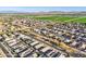 High angle view showcasing neighborhood, street, green fields and mountain range with desert landscaping at 25634 W Samantha Way, Buckeye, AZ 85326