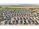 Wide aerial view of a large residential community with agriculture in the background at 25634 W Samantha Way, Buckeye, AZ 85326