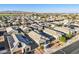 Aerial view of neighborhood featuring uniform homes, tile roofs, desert landscaping and mountain views at 25634 W Samantha Way, Buckeye, AZ 85326