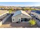 This aerial showcases a home's private backyard, desert landscaping, and cozy covered patio seating area at 25634 W Samantha Way, Buckeye, AZ 85326