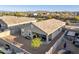 Aerial view capturing the spacious backyard, featuring desert landscaping and a covered patio area at 25634 W Samantha Way, Buckeye, AZ 85326