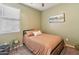 Cozy bedroom featuring carpet floors, one window with blinds, and warm wall color at 25634 W Samantha Way, Buckeye, AZ 85326