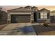 Charming single-Gathering home featuring desert landscaping and a two-car garage at 25634 W Samantha Way, Buckeye, AZ 85326