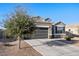 Charming single-Gathering home featuring desert landscaping and a two-car garage at 25634 W Samantha Way, Buckeye, AZ 85326