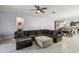 Spacious living room seamlessly connects to the dining area, creating an open and airy feel at 25634 W Samantha Way, Buckeye, AZ 85326