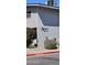 Exterior view of a light gray two-story building with well-manicured landscaping and shrubs at 2616 W Berridge Ln # C2, Phoenix, AZ 85017