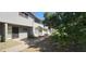 Exterior view of a two-story apartment building with a walkway and some mature trees providing shade at 2616 W Berridge Ln # C2, Phoenix, AZ 85017