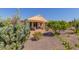 A beautifully landscaped backyard featuring a mix of desert plants at 26237 W Vista North Dr, Buckeye, AZ 85396