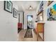 Bright entryway with tile flooring, wooden accents, and access to other areas of the home at 26237 W Vista North Dr, Buckeye, AZ 85396