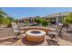 The backyard features a fire pit and outdoor seating with a landscape at 26237 W Vista North Dr, Buckeye, AZ 85396