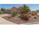 Charming single-story home featuring desert landscaping with cacti and native plants adding to the curb appeal at 26237 W Vista North Dr, Buckeye, AZ 85396