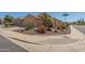 Single story home with well-maintained desert landscaping and corner lot with street sign at 26237 W Vista North Dr, Buckeye, AZ 85396