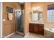 This bathroom features a large walk-in shower, vanity, and natural light from the window at 26293 W Runion Ln, Buckeye, AZ 85396