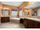 This bathroom features a large soaking tub, dual sink vanities, and plenty of natural light at 26293 W Runion Ln, Buckeye, AZ 85396