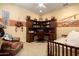 This bedroom features wood furniture and decor that follows a Native American theme at 26293 W Runion Ln, Buckeye, AZ 85396