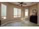 Bright dining area with tile floors, large windows with blinds, and a modern black buffet at 26293 W Runion Ln, Buckeye, AZ 85396