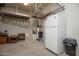 Garage with a refrigerator, water heater, water softener, shelving and storage furniture at 26293 W Runion Ln, Buckeye, AZ 85396