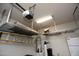 Garage with overhead shelving for storing large or seasonal items at 26293 W Runion Ln, Buckeye, AZ 85396