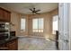 Bright kitchen area with stainless appliances, tile flooring, and a ceiling fan at 26293 W Runion Ln, Buckeye, AZ 85396