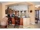 View of kitchen featuring granite countertops, stainless steel appliances, and breakfast bar seating at 26293 W Runion Ln, Buckeye, AZ 85396